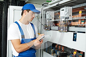 Electrician worker inspecting photo