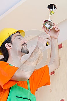 Electrician working on cabling