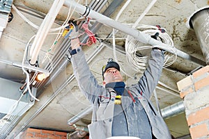 Electrician working with cabling photo