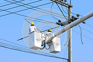 Electrician working on electric pole