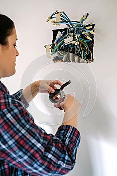 Electrician working on the electrical installation of a house