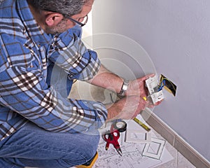 Electrician working in the electrical plant.