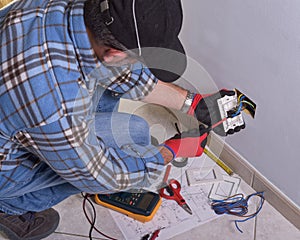 Electrician working in the electrical plant.