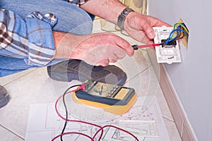 Electrician working in the electrical plant.