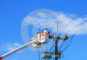 Electrician working repair wire of the power line