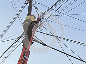 Man Repairing Electricity Telephone Pole Lines