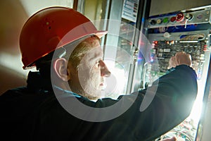 Electrician works with electronic equipment