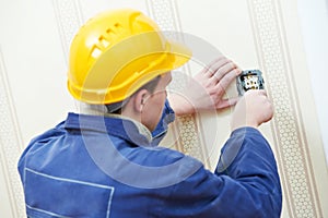 Electricians at cable wiring work