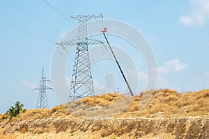 Electricians are engaged in maintenance of power lines