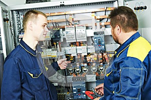 Electricians engineers near distribution box