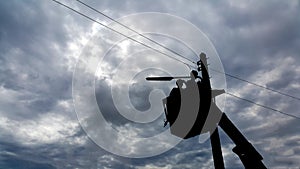 Electricians repair the power line with a lift