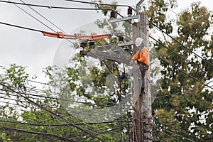 electricians repairing wire of the power line on electric power