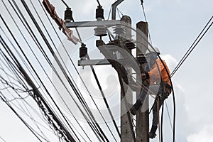 electricians repairing wire of the power line on electric power