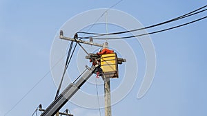 Electricians work on high voltage