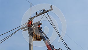 Electricians work on high voltage