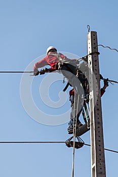 Electricians working on a pylon