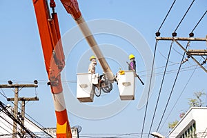Electricians working to repair the power line