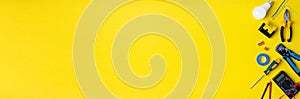 Electriciantools on a yellow background. Banner with space for text
