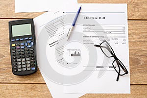 Electricity bill charges paper form on a table photo