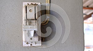 Electricity breaker installed on cement wall