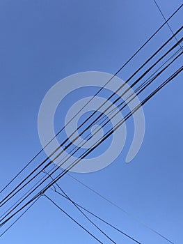 electricity cable over a blue sky