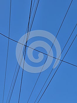 electricity cable over a blue sky