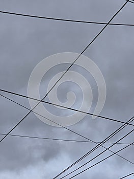 electricity cable over a cloudy sky