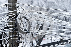 Electricity cables covered in ice after frozen rain