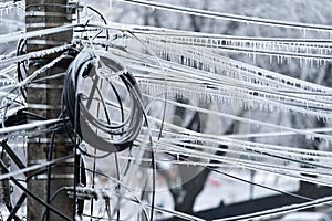 Electricity cables covered in ice after frozen rain