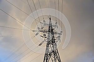 Electricity concept, high voltage power lines. High voltage electric transmission pylon tower. Wire electrical energy