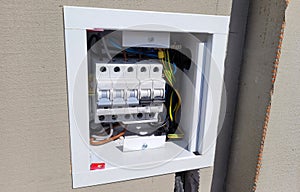 electricity distribution box with wires and circuit breakers