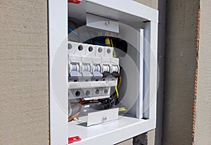 electricity distribution box with wires and circuit breakers