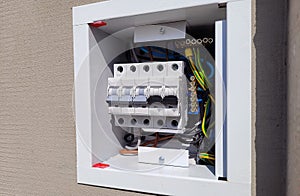 electricity distribution box with wires and circuit breakers
