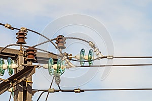 Electricity garland of insulators with electric wires on a top mast support