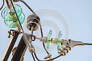 Electricity garlands of insulators with electric wires on a top steel mast support