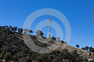 Electricity generating windmill Farms Hume Highway NSW Australia taken from moving car blurred foreground