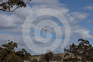 Electricity generating windmill Farms Hume Highway NSW Australia taken from moving car blurred foreground