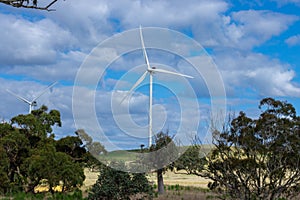 Electricity generating windmill Farms Hume Highway NSW Australia taken from moving car blurred foreground