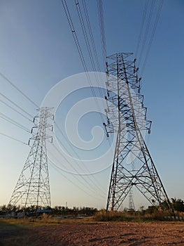 Electricity high voltage pole Pylon tower station against blue sky