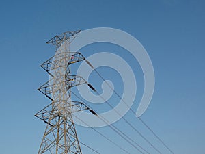 Electricity high voltage pole Pylon tower station against blue sky