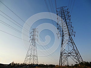 Electricity high voltage pole Pylon tower station against blue sky