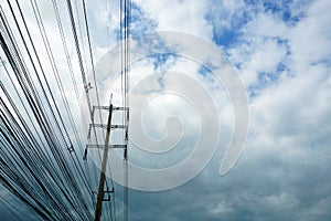 Electricity high voltage pylon and white blue sky