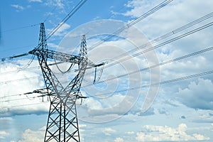 electricity lines on blue sky background. high-voltage power lines on transmission tower, energy voltage, electric tower