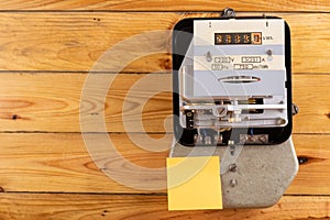 Electricity meter and clean notes. Home device for measuring the consumption of electricity photo