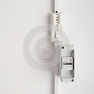 Electricity meter in a white wall