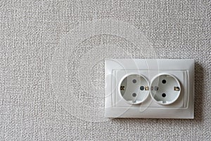 Electricity Outlet in Room after remodeling Process with Grey Wallpaper on Wall for Copy Space