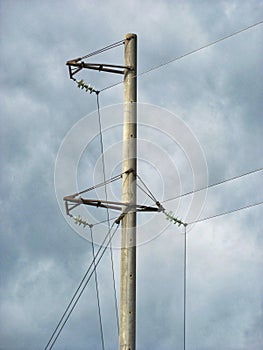 Electricity Pole Against Cloudy Sky