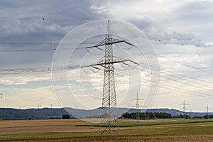 Electricity pole on the field in the countryside