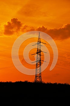 Electricity pole at sunset