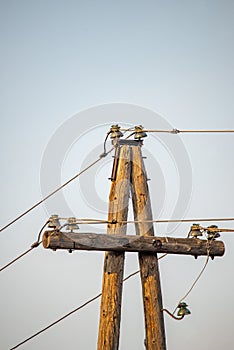 electricity post with blue sky background, power transmission and distribution concept